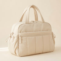 Sac à langer puffer crème de trois quarts, avec sa poche latérale